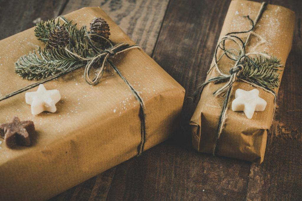 two wrapped holiday gifts