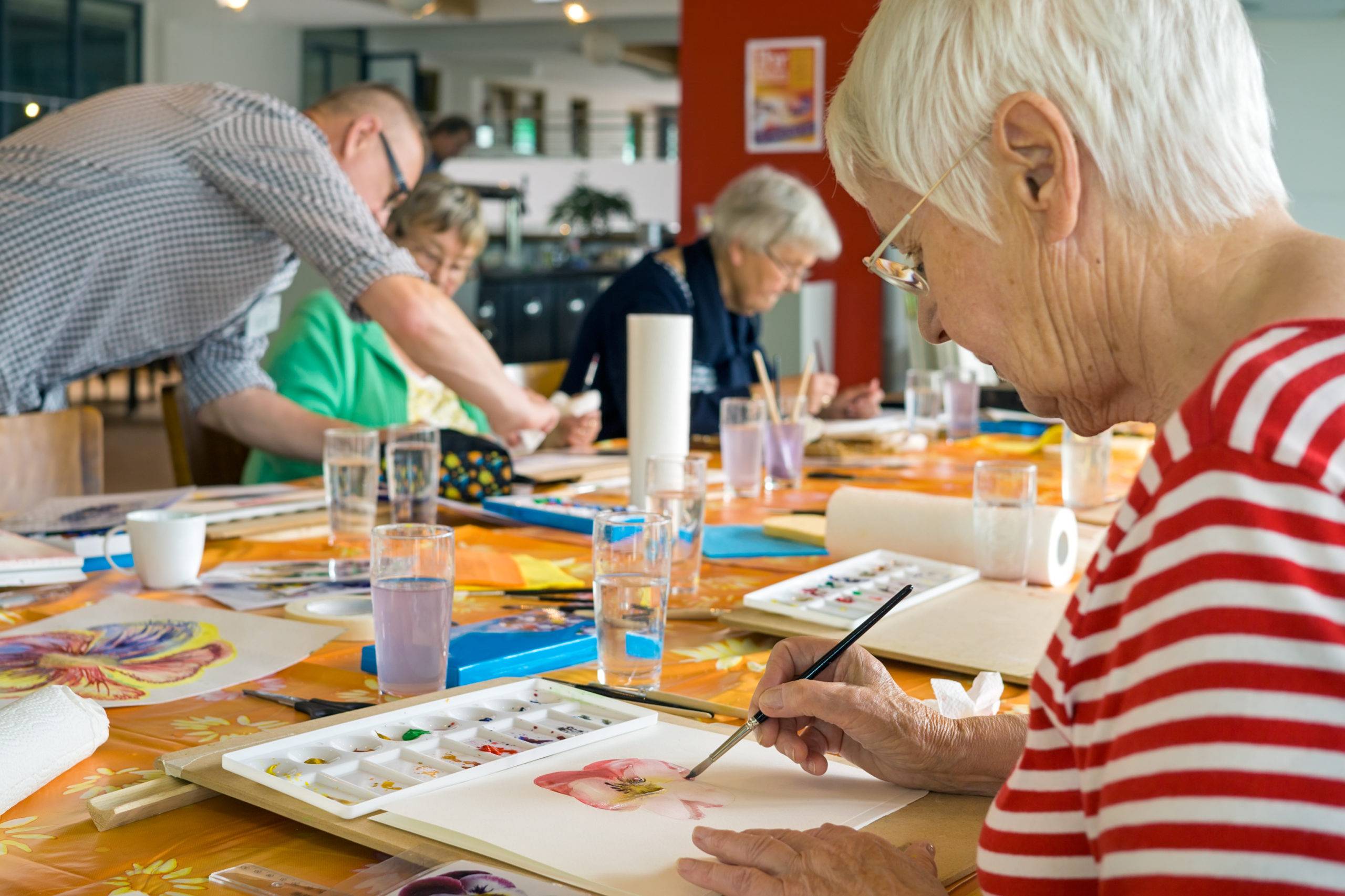 Woman working on watercolor painting