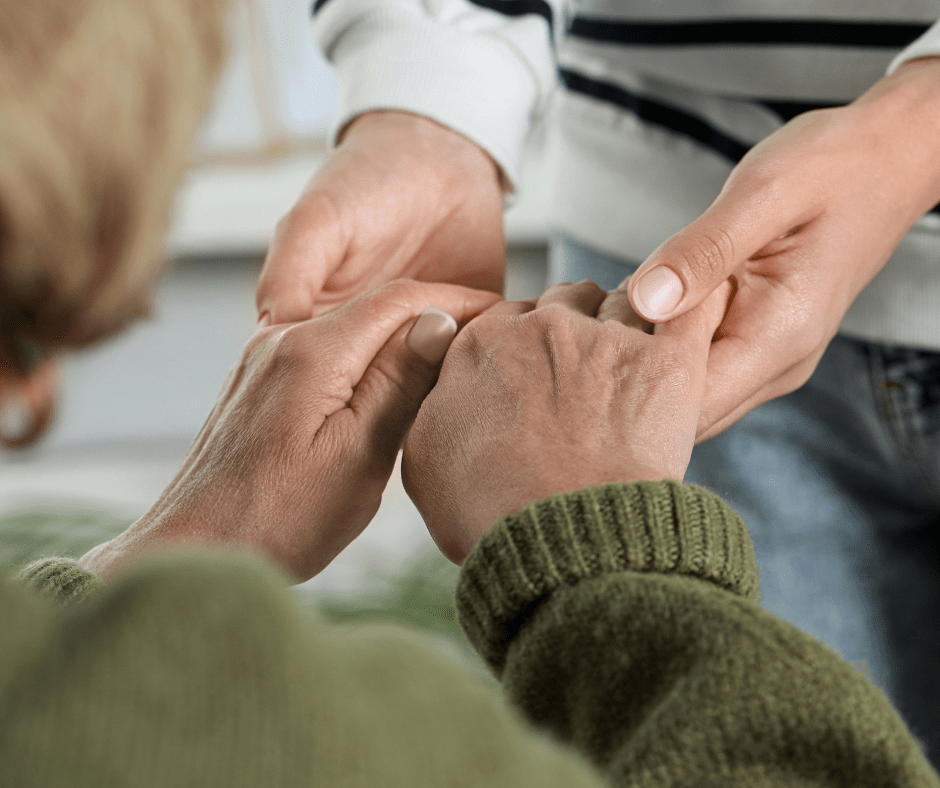 two people holding both hands