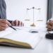 Law office consultation with books and paperwork